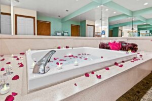 Box Canyon Lodge & Hot Springs honeymoon suite soaking bathtub with rose petals sprinkled around